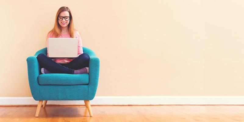 Illustrative picture of a women holding a lap top